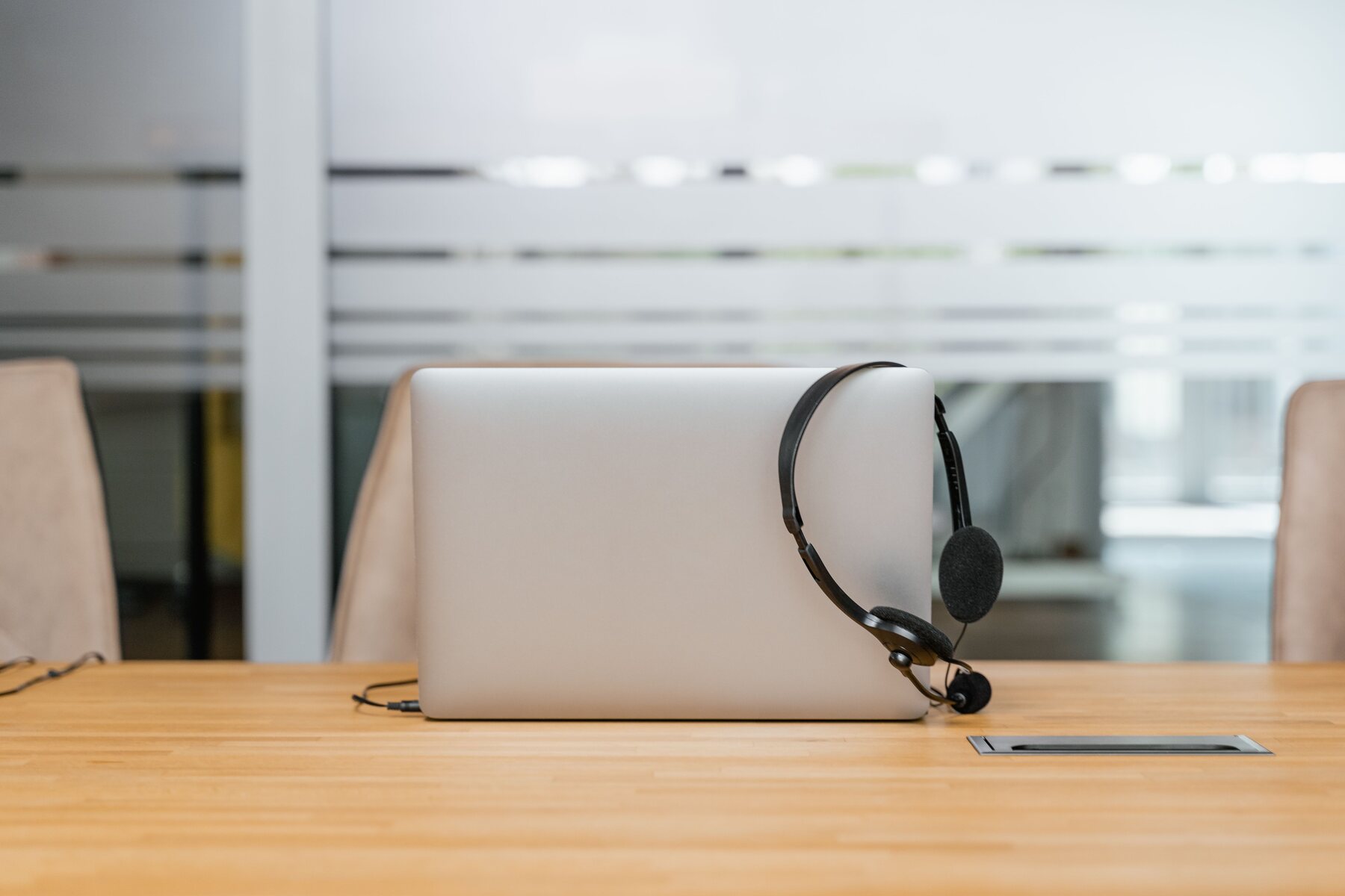 Laptop and headset prepared for a professional conversation